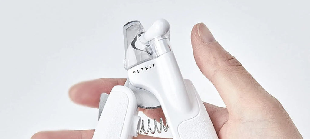 White LED pet nail clippers with transparent anti-splash guard open to show triangular stainless steel blades