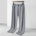Man wearing black Ice Silk straight leg casual trousers with an elasticated waist.