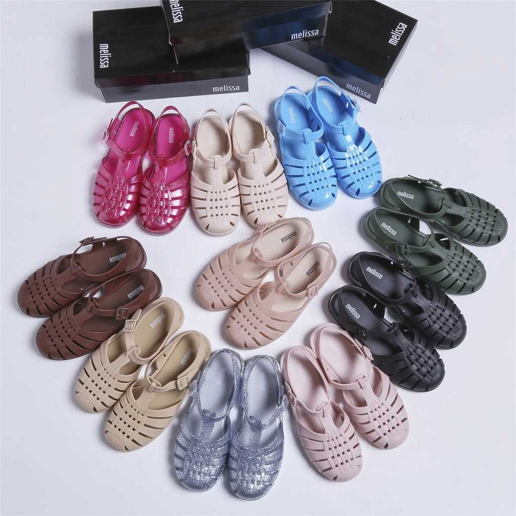 Roman sandals with buckle closure in PVC material showing vintage weave design and hollow-out elements