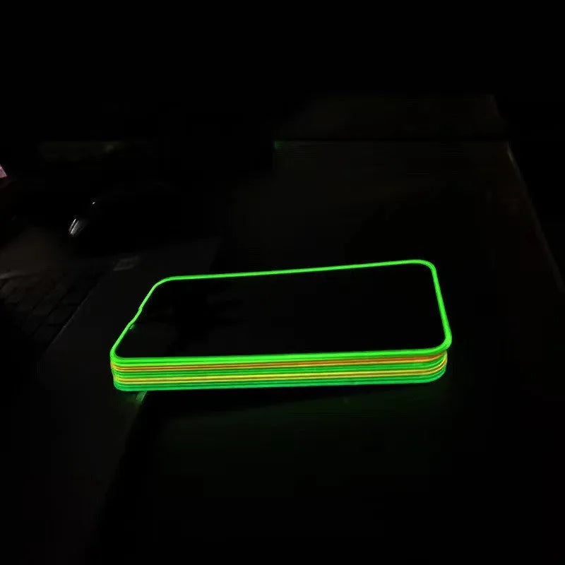 Luminous tempered glass screen protector for iPhone with glowing pink edge on a mobile phone.