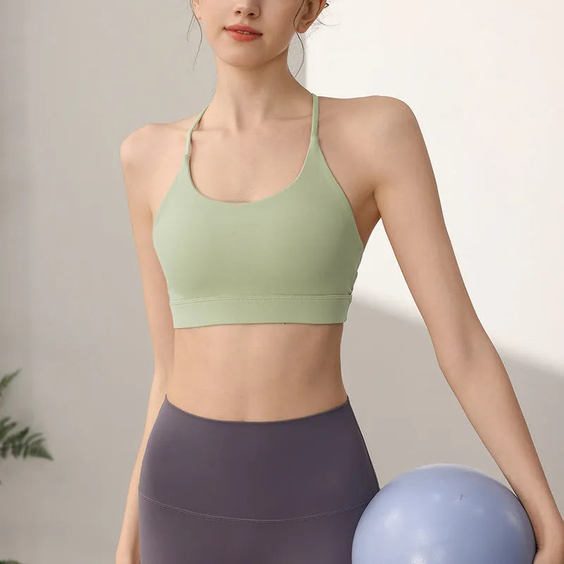 Women's nylon sports vest with fixed double-shoulder straps in multiple colours on a size chart.