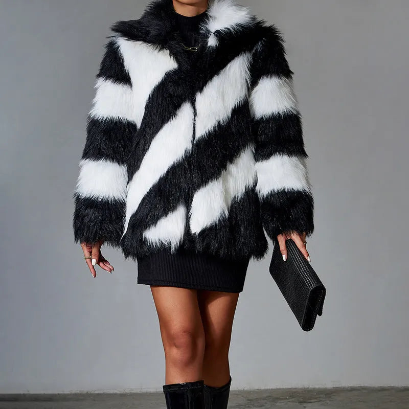 Women's faux fur coat with dark contrast lapels and a light fur collar.