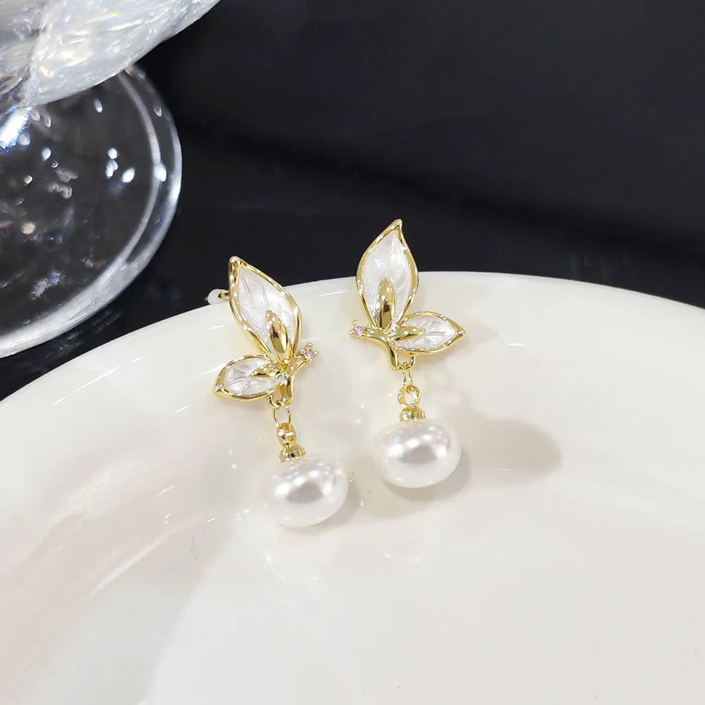Copper butterfly earrings with zircon painted detail and electroplated finish