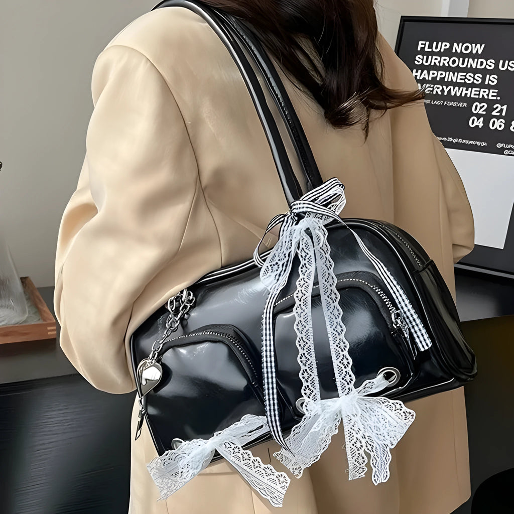 Women's soft PU leather shoulder bag in horizontal square shape with phone compartment.