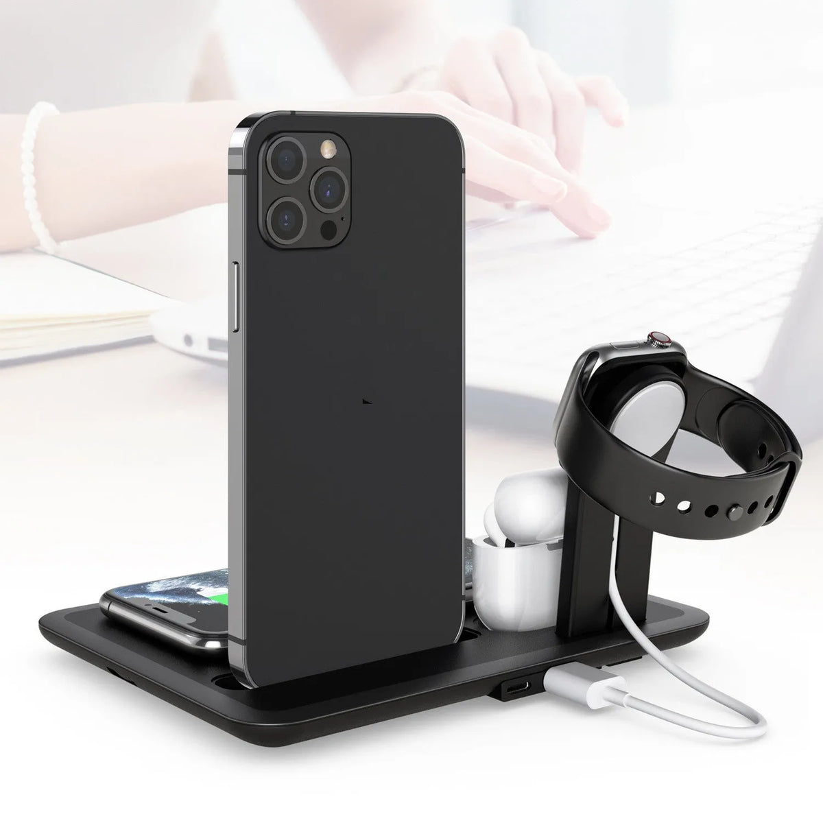 Black desktop wireless charging station with phone bracket, watch and headphone charging ports