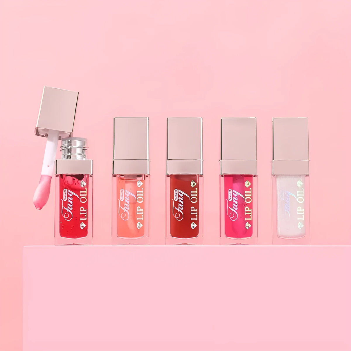 Five colour shades of moisturising lip gloss mint lipstick with lip essence oil.