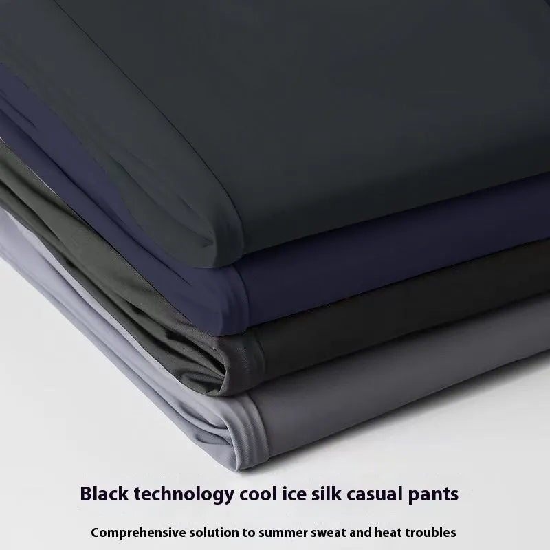 Man wearing black Ice Silk straight leg casual trousers with an elasticated waist.