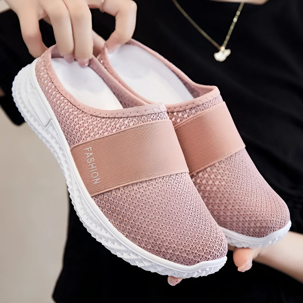 Women's black mesh casual flat shoes with hollow-out design and round toe on a flat heel.