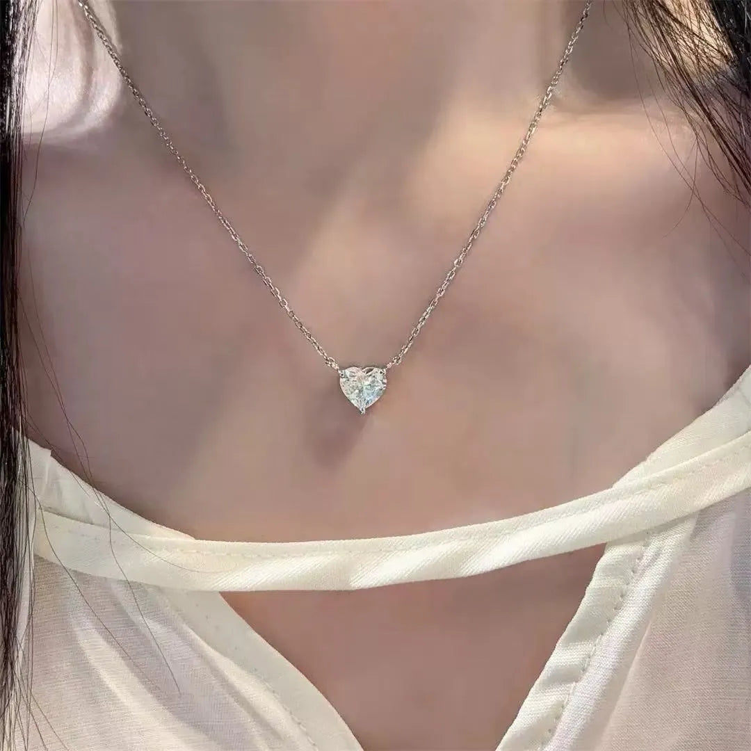 Women's silver heart necklace with copper construction and simple refined grace design