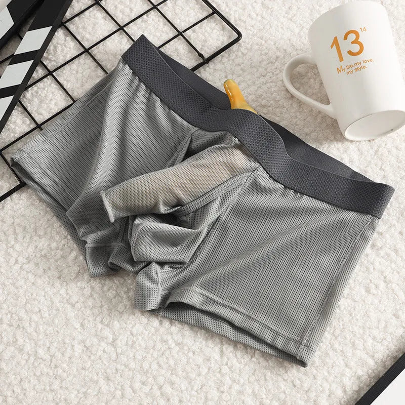 Men's ice silk boxer shorts in black colour showing low-waist design and mesh fabric texture