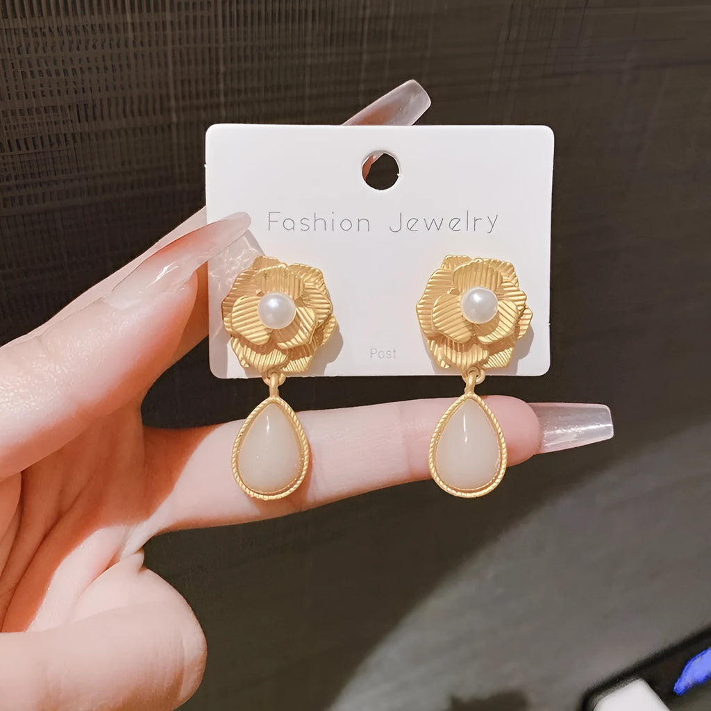Gold electroplated Hong Kong style stud earrings with needle rose pearl and opal stone design.