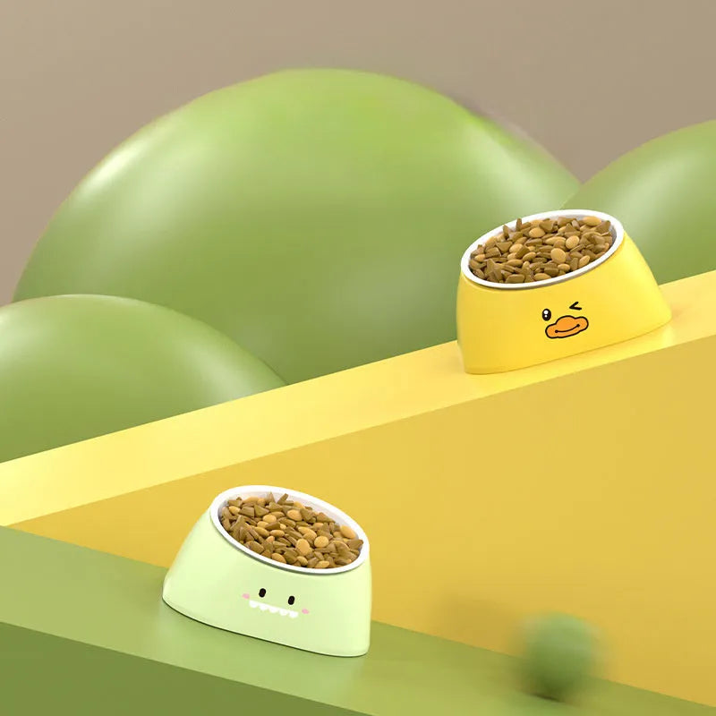 Green tilted stainless steel cat bowl with 15 degree angle on white PP plastic base