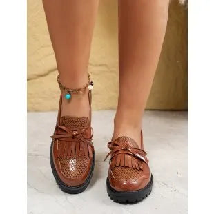 Women's brown loafers with decorative bow detail on artificial PU leather upper