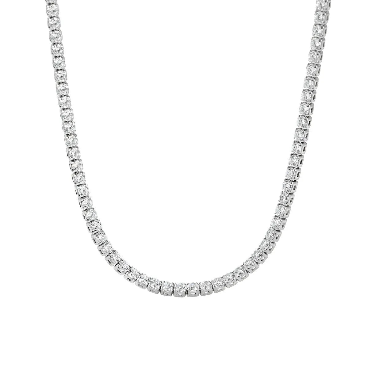 Close-up of a women's sterling silver necklace with round diamond-cut elements on a polished chain.
