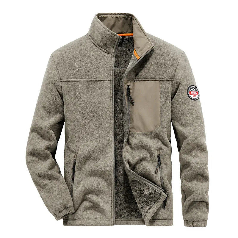 Man wearing a grey spandex fleece cardigan jacket with zippered pockets.