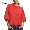 Red cropped viscose t-shirt on a hanger, showing its short length and regular sleeves.
