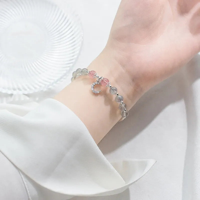 Handmade adjustable silver tone bracelet with natural moonstone crystal and small crescent moon charm