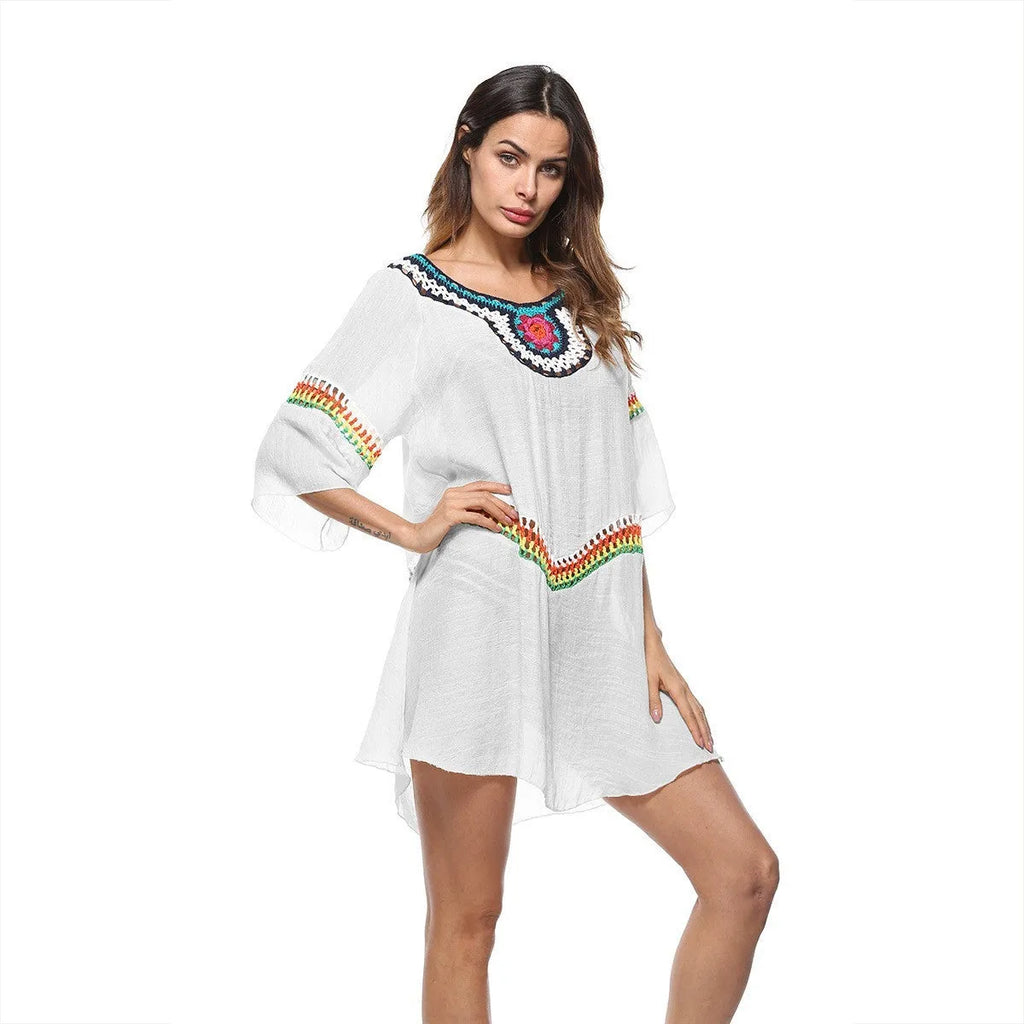 Crocheted ethnic style women's beach cover-up in acrylic fabric for sun protection.