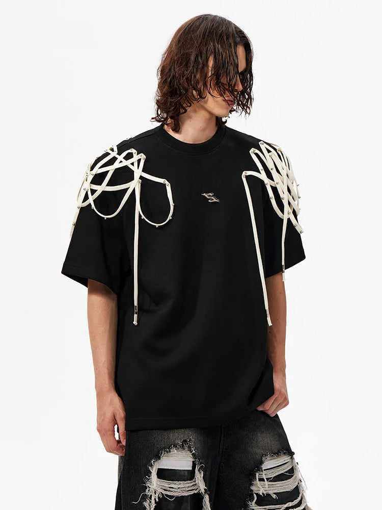 Black short-sleeved t-shirt with padded shoulders and rivet ribbon detail in loose fit round neck style