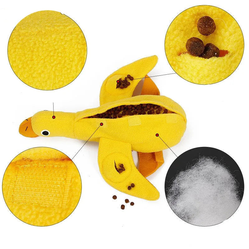 Yellow plush duck dog toy with squeaker and food leak compartment for treats.