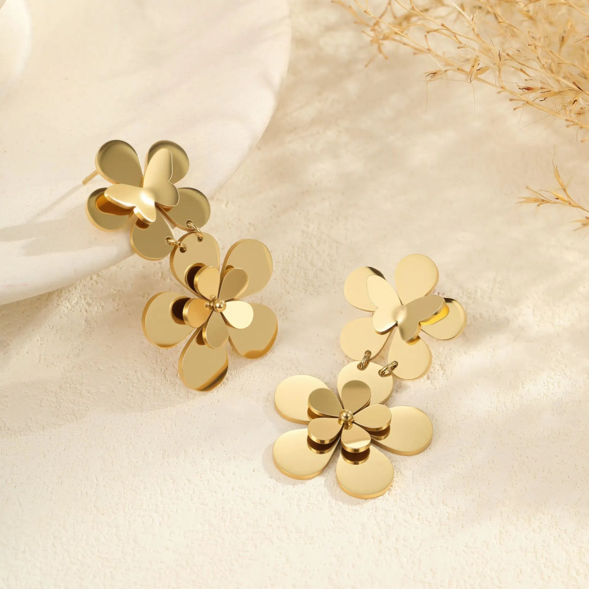 Gold electroplated stainless steel women's earrings with floral butterfly design