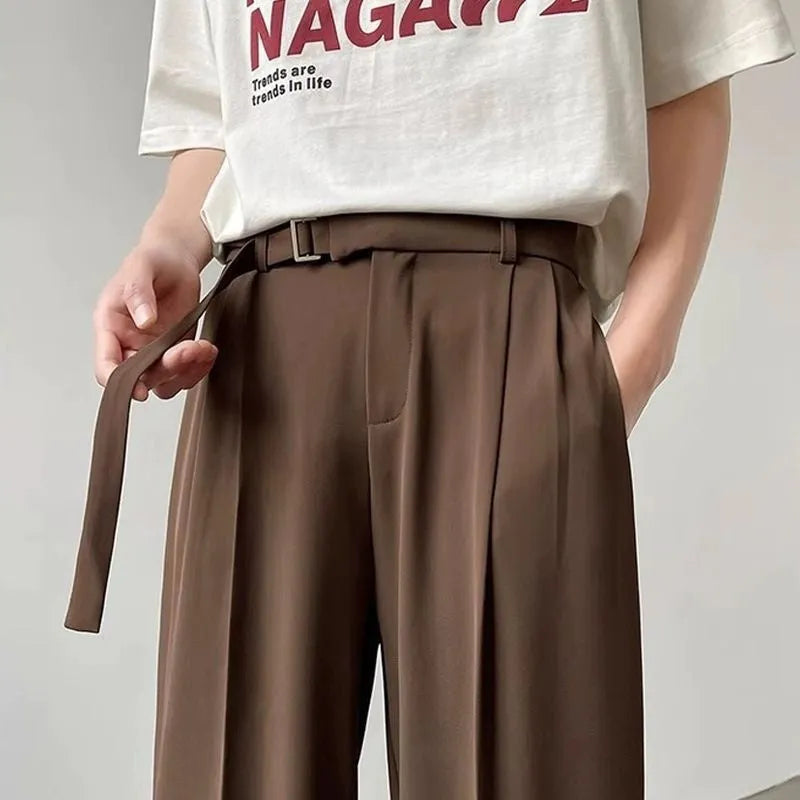 Straight-leg wide-leg trousers in black, made from a thin chemical fibre blend fabric.
