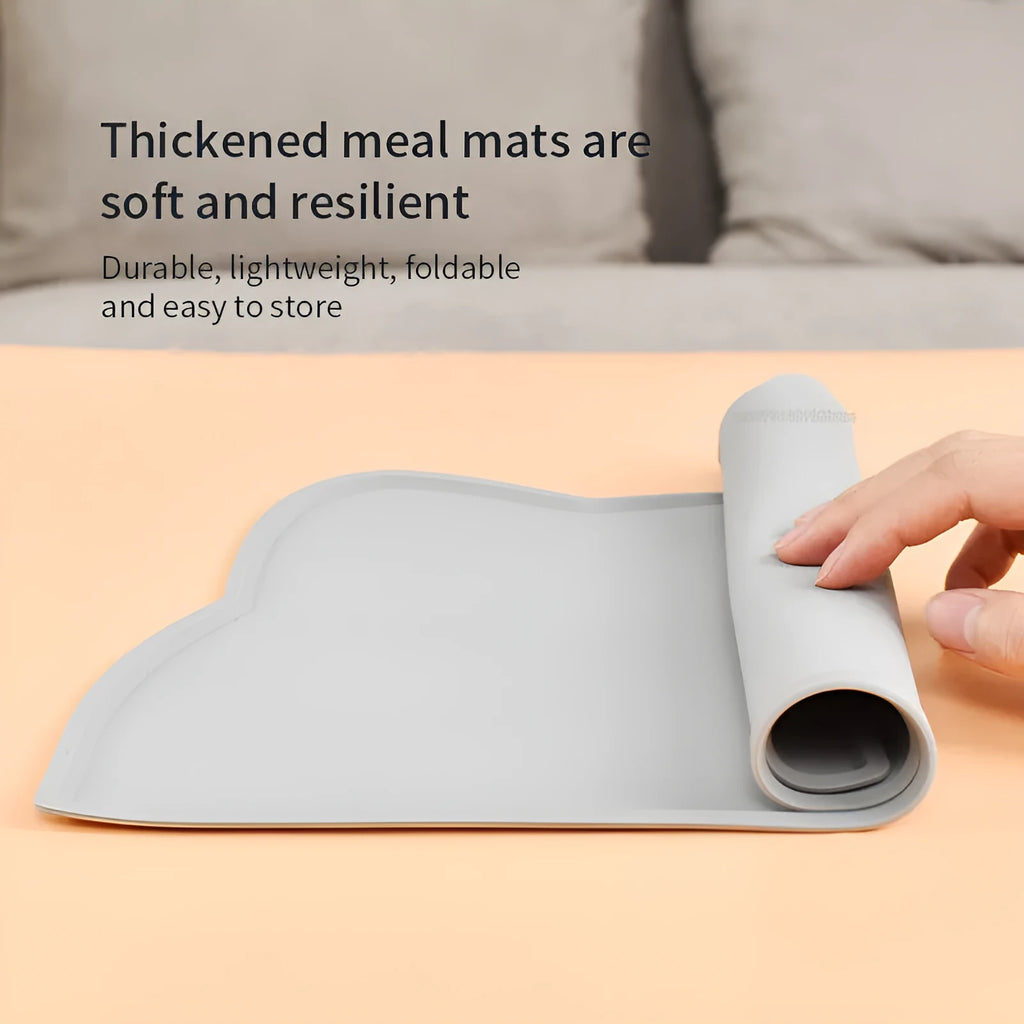 Blue waterproof silicone pet feeding mat for dog and cat bowls on a wooden floor