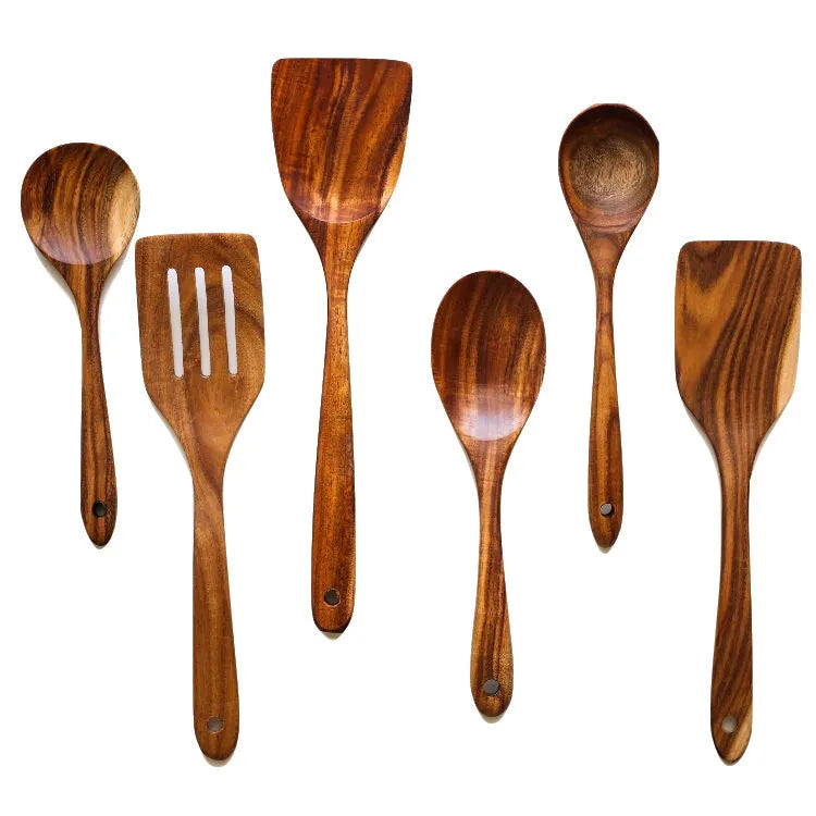 Premium wooden cooking utensils seven-piece set including spoon and spatula on kitchen counter