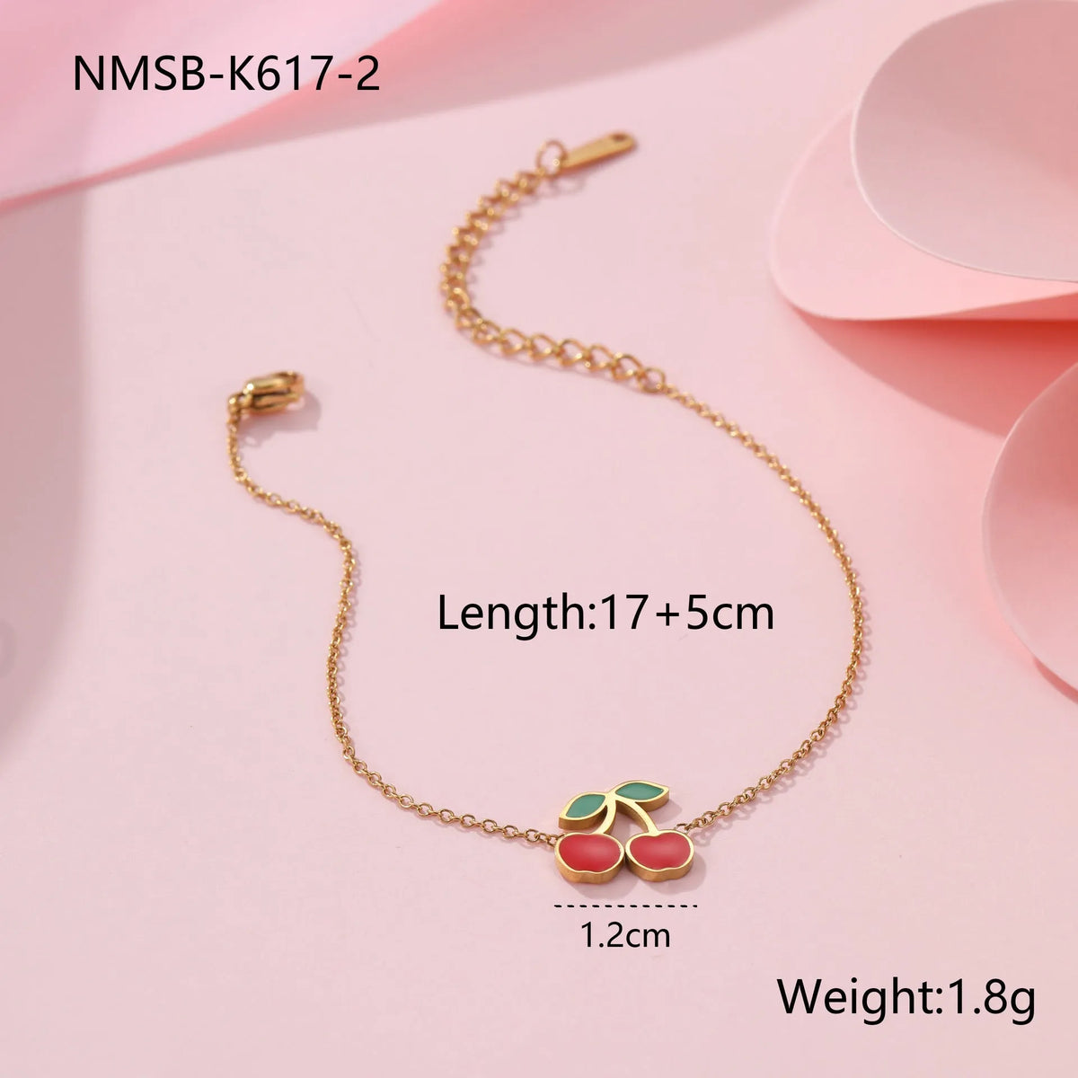 Cherry jewellery set showing necklace, bracelet, earrings, and ring with stainless steel construction and gold plating