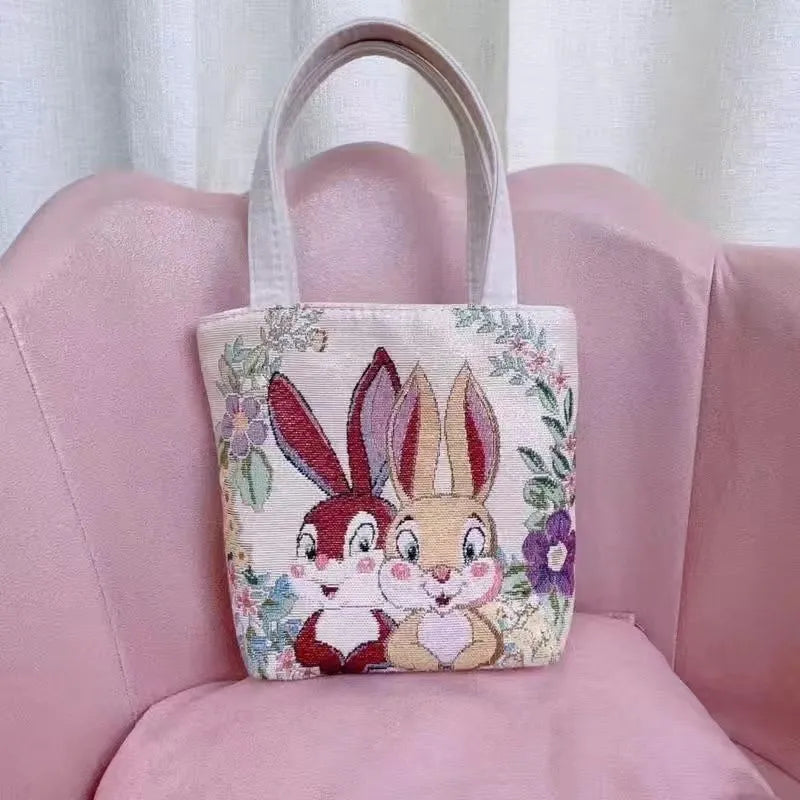 Gold wire embroidered canvas tote bag in choice of seven designs and three sizes.
