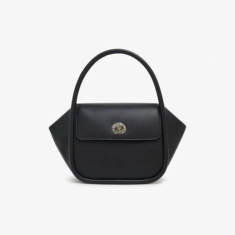Soft cow leather wing-shaped tote handbag with a buckle latch and single cross-body shoulder strap.