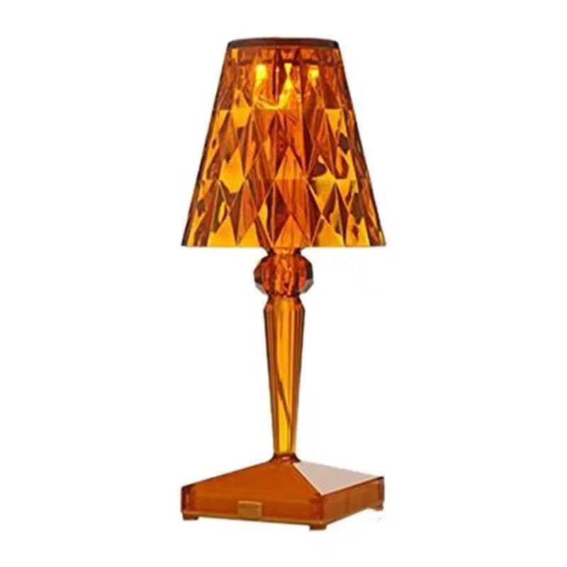 Rose gold plated portable touch night light with rechargeable battery on a surface