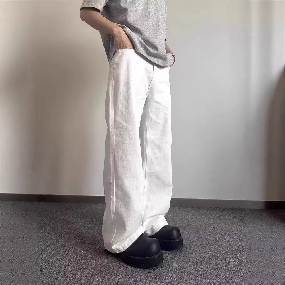 Men's white straight-leg cotton jeans with a mid-rise waist and zipper fly