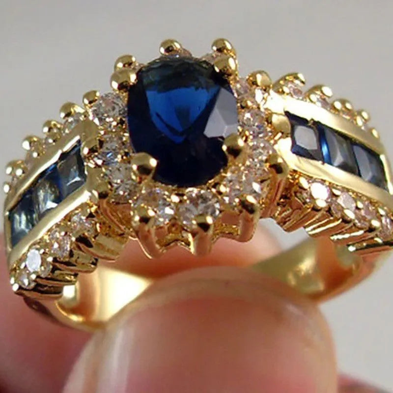 Personalised zinc alloy ring for men and women in a choice of three designs: sunflower blue diamond, square blue zircon, or square purple zircon.