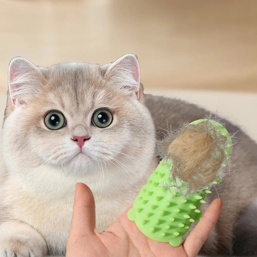 Silicone cat grooming comb with adjustable strap attached to table leg for hair removal and scratching relief