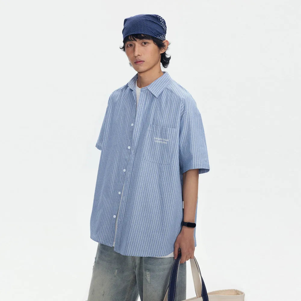Blue and white striped loose-fitting short sleeve shirt cardigan style on hanger