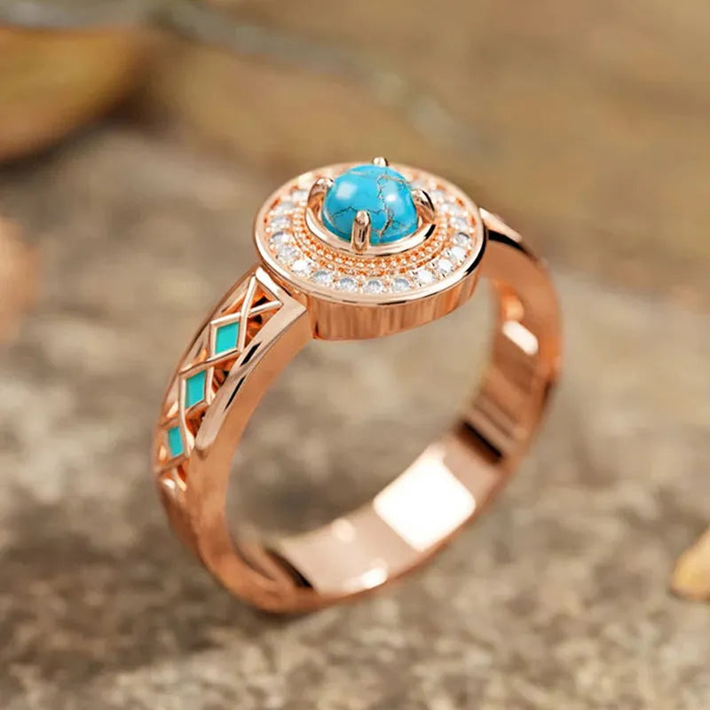 Women's turquoise ethnic style ring with zircon inlay and rose gold finish on copper, geometric shape.