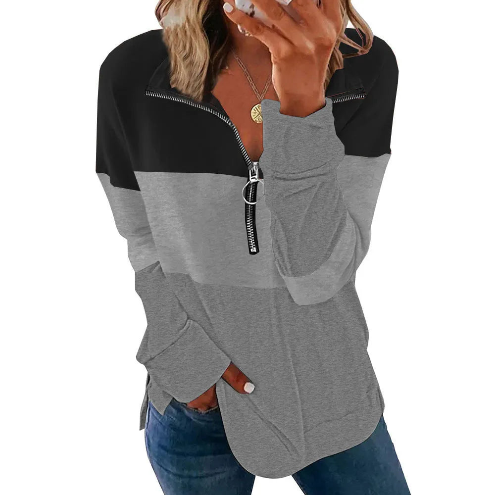 Women's loose-fitting long-sleeved leopard print pullover sweater on a hanger.
