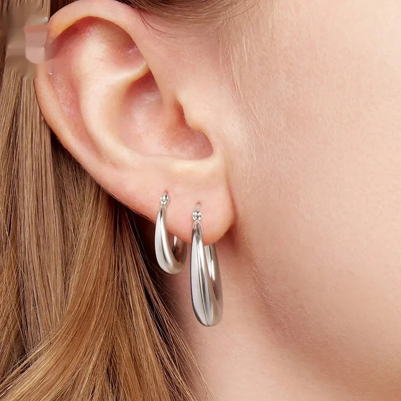 Copper geometric ring ear clip earrings showing large, medium, and small size options with silver needle fastenings
