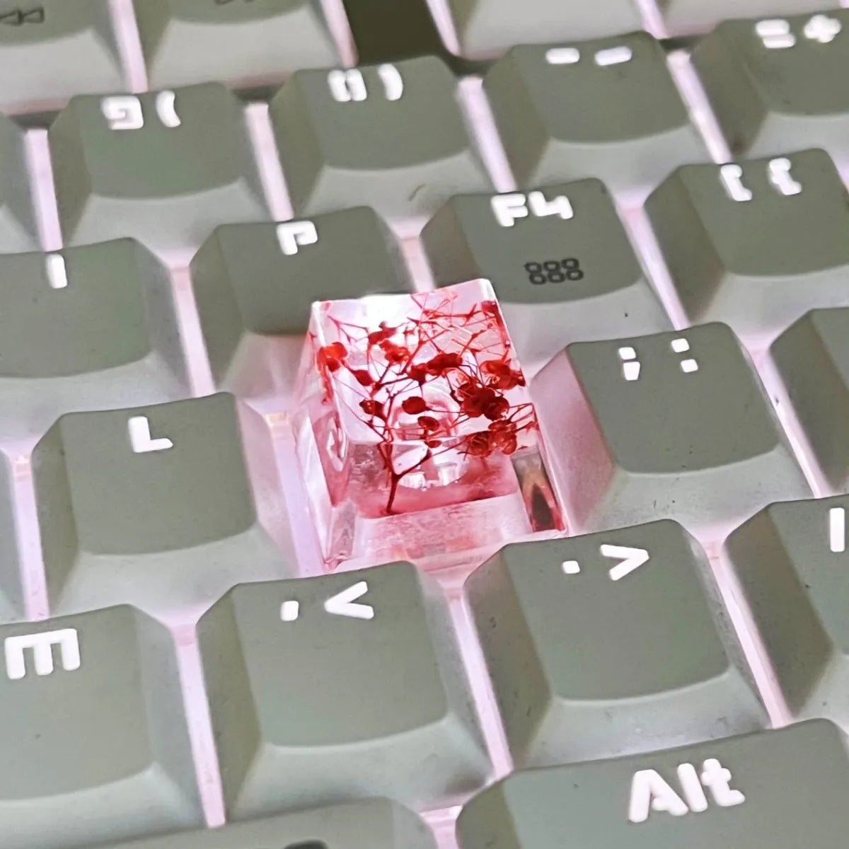Clear resin mechanical keyboard keycap with starry sky design in green.