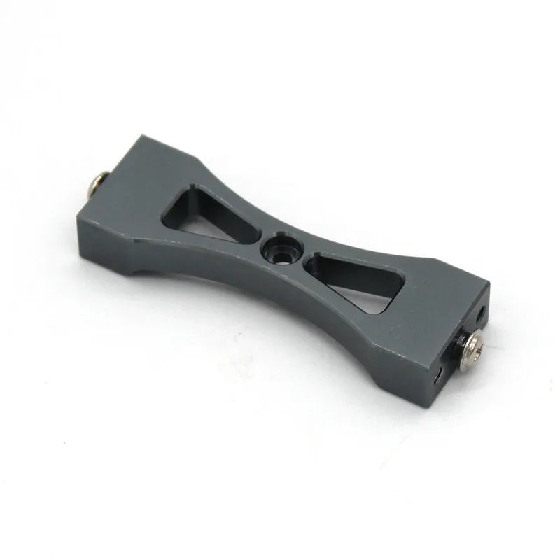 Grey alloy metal parts and black tyres for a military remote control car model accessory kit.