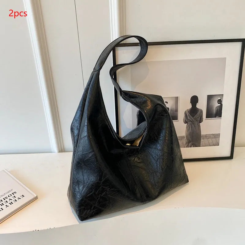 Soft leather casual shoulder bag with sandwich pocket design and large storage capacity