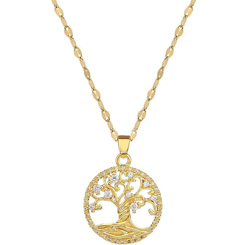 Gold-plated necklace with rhinestone tree pendant featuring mother-of-pearl detail on adjustable lip chain
