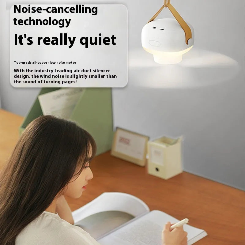 Small rechargeable camping fan with LED night light mounted in tent with remote control