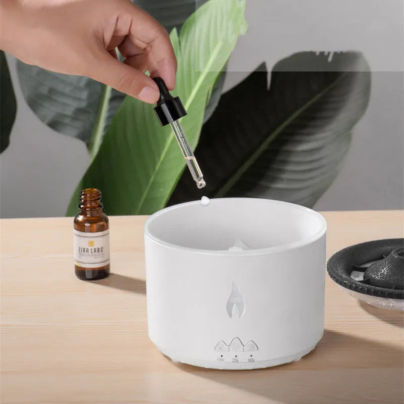 Volcano-shaped humidifier emitting a two-colour mist ring on a table.