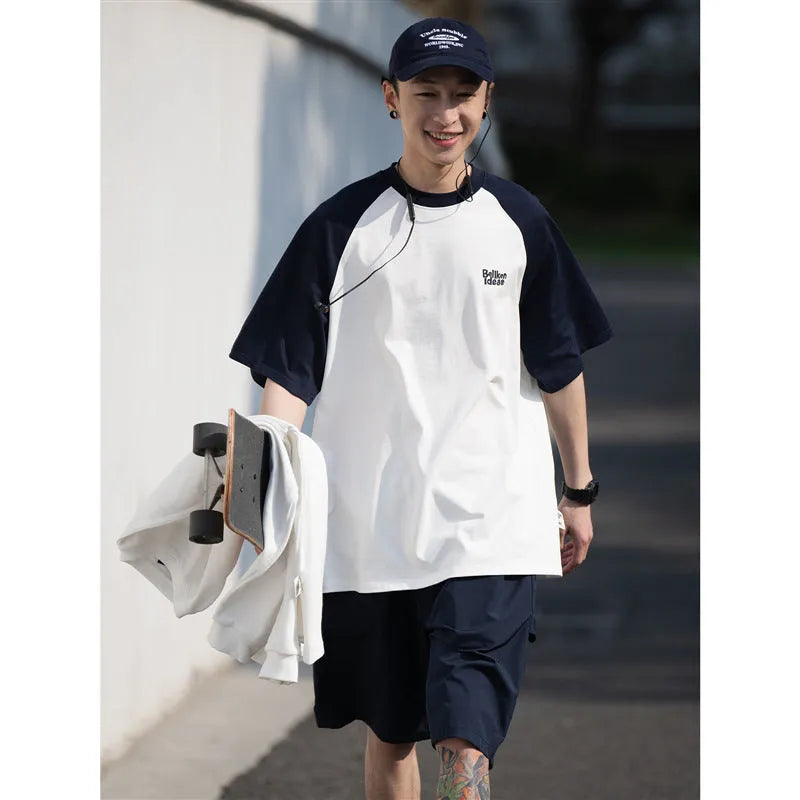 Men's blue Japanese-style raglan sleeve t-shirt with loose fit on hanger