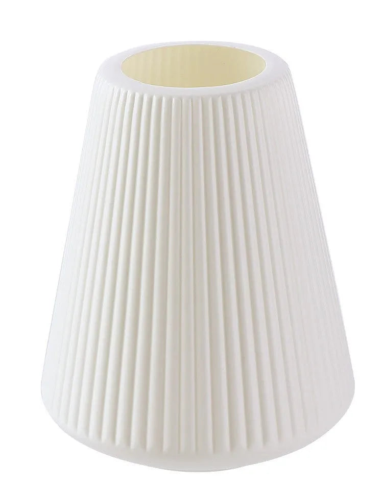 Colourful melamine plastic decorative flower vase on a tabletop.