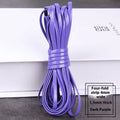 Coiled PU leather woven cord in multiple colours showing beige, black, blue, and red options on a wooden surface.