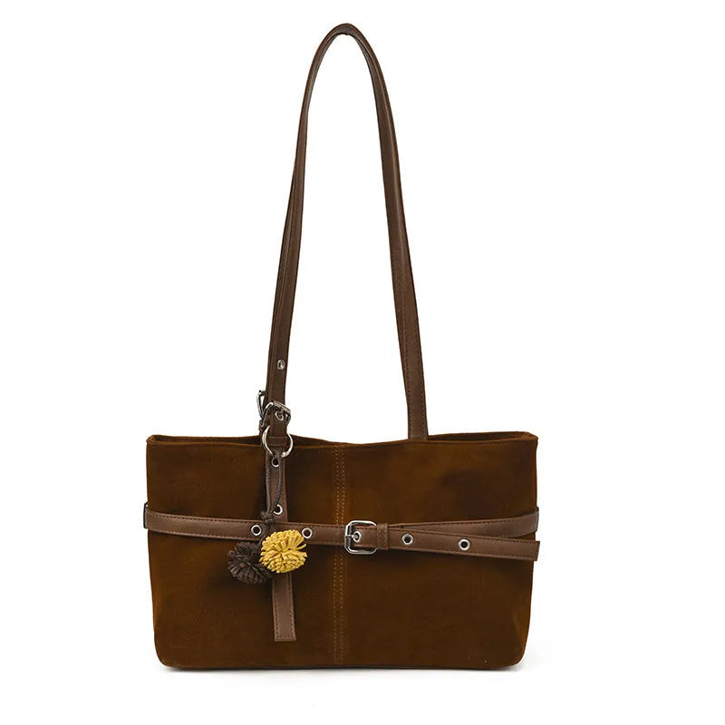 One-shoulder underarm tote bag in PU with polyester lining, zip coin pocket, and splicing detail.