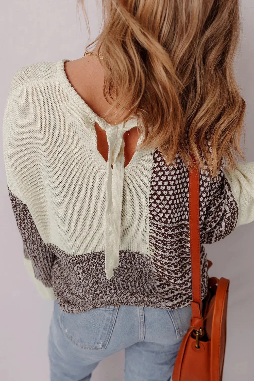 Dark khaki loose sweater with colour block pattern and back tie detail, drop shoulder design